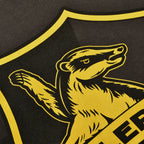 Immagine del prodotto T-shirt grigia con logo Hufflepuff - Harry Potter