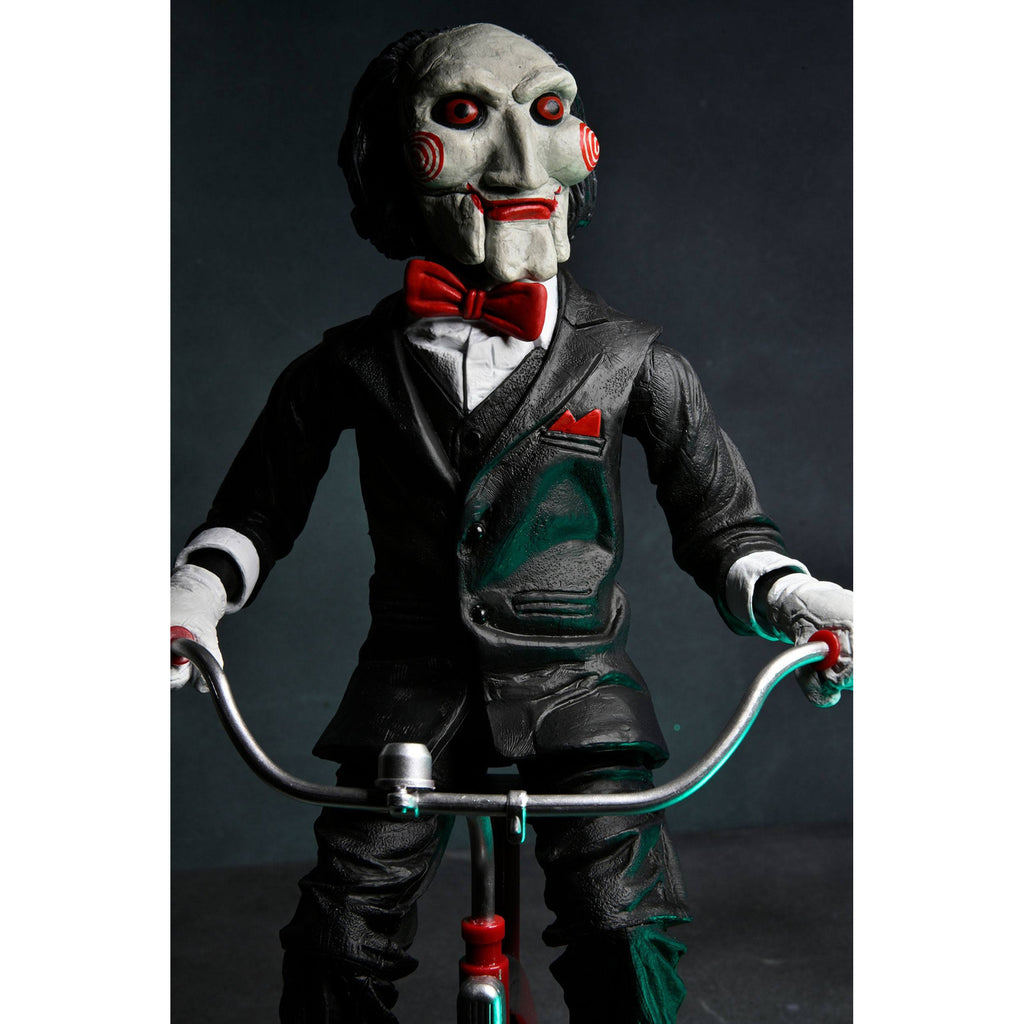 Image produit Figurine articulée Saw avec son Billy sur tricycle 30 cm